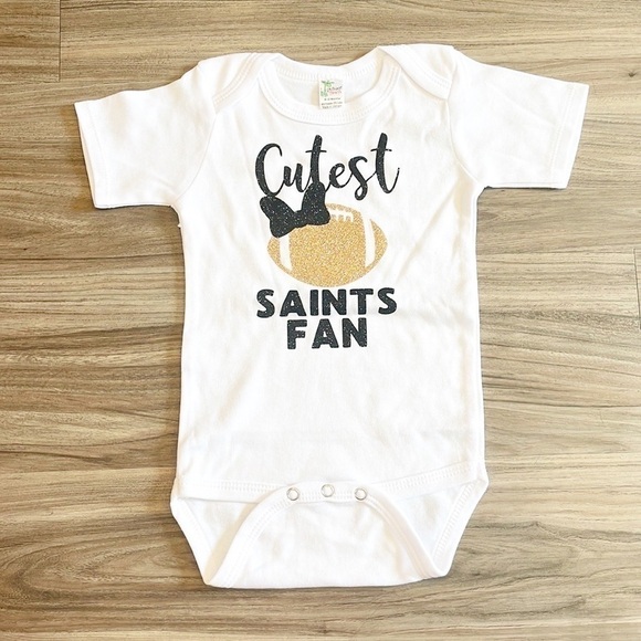 Laughing Giraffe Cutest Saints Fan black/gold glitter baby bodysuit - Picture 1 of 4